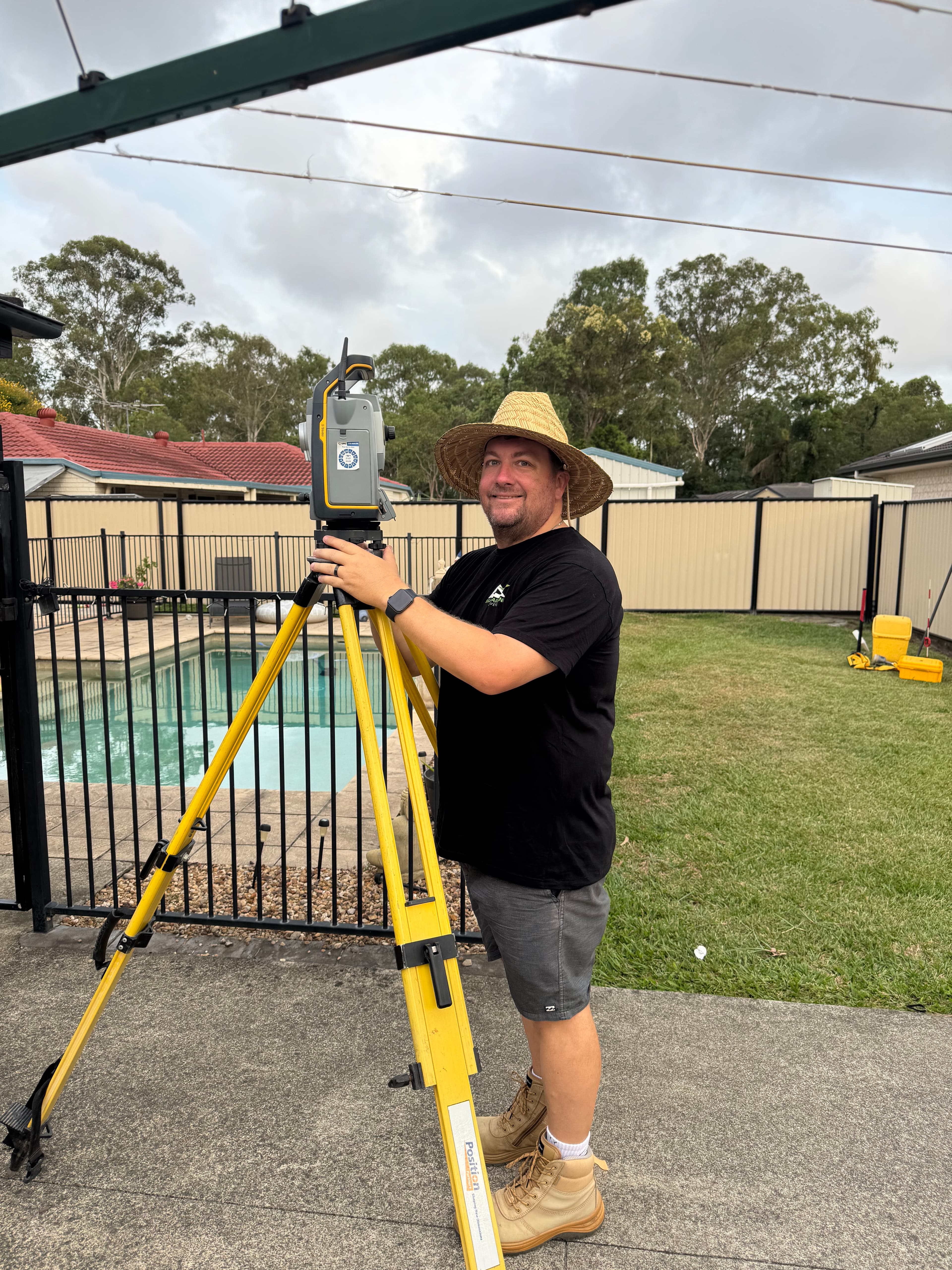 Luke Buxton reviewing survey plans on site
